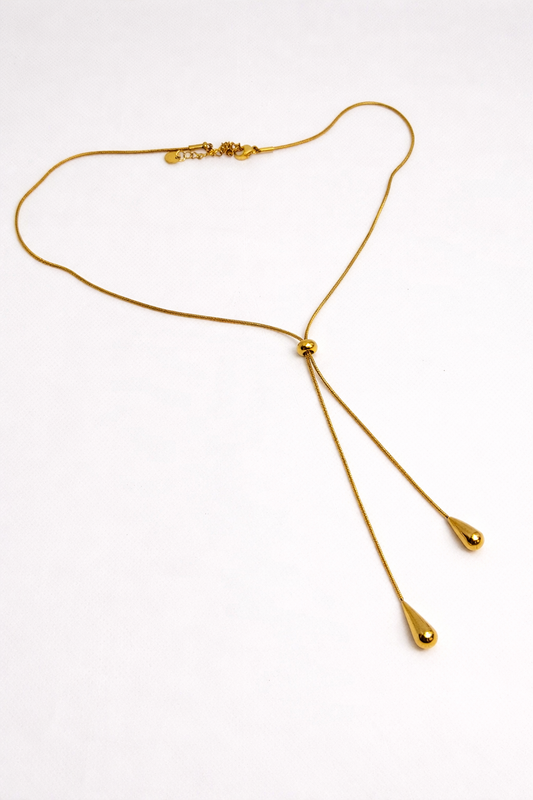 Gold drop necklace with teardrop pendants — elegant, minimal and fluid design.