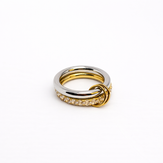 Dual-tone gold and silver statement ring with knot detail by Atelier Épure — modern, bold and elegant.