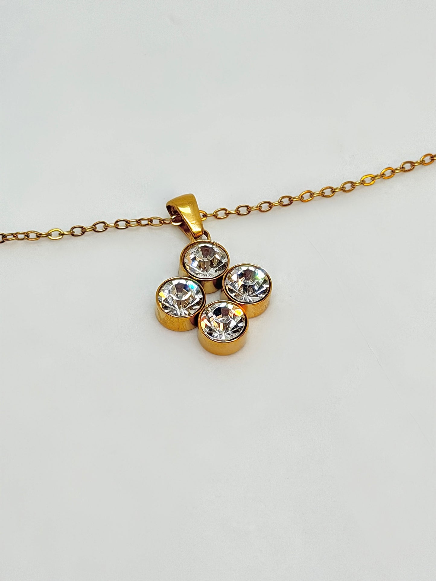 Gold-plated jewellery set with zirconia stones by Atelier Épure  elegant, structured, and timeless.