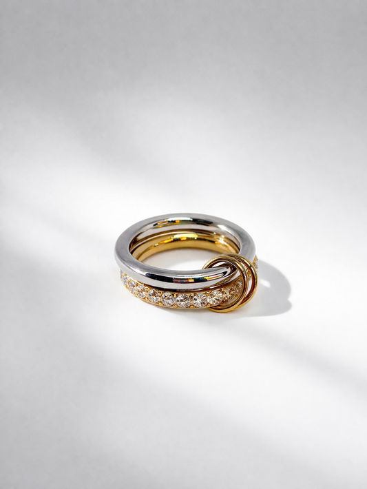 Dual-tone gold and silver statement ring with knot detail by Atelier Épure — modern, bold and elegant.