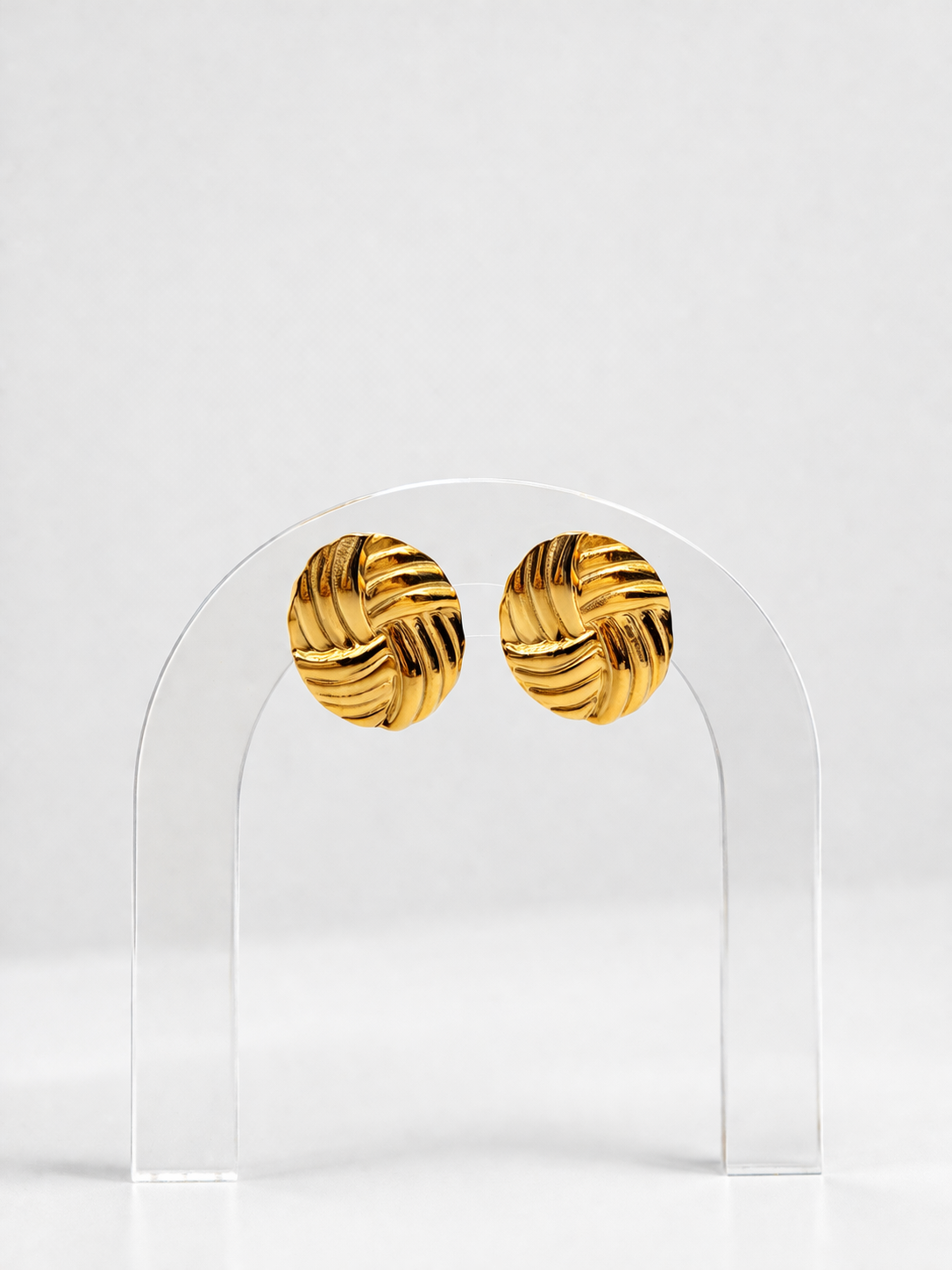 Gold sculpted earrings by Atelier Épure with a textured knot-inspired design — elegant, timeless, and refined.