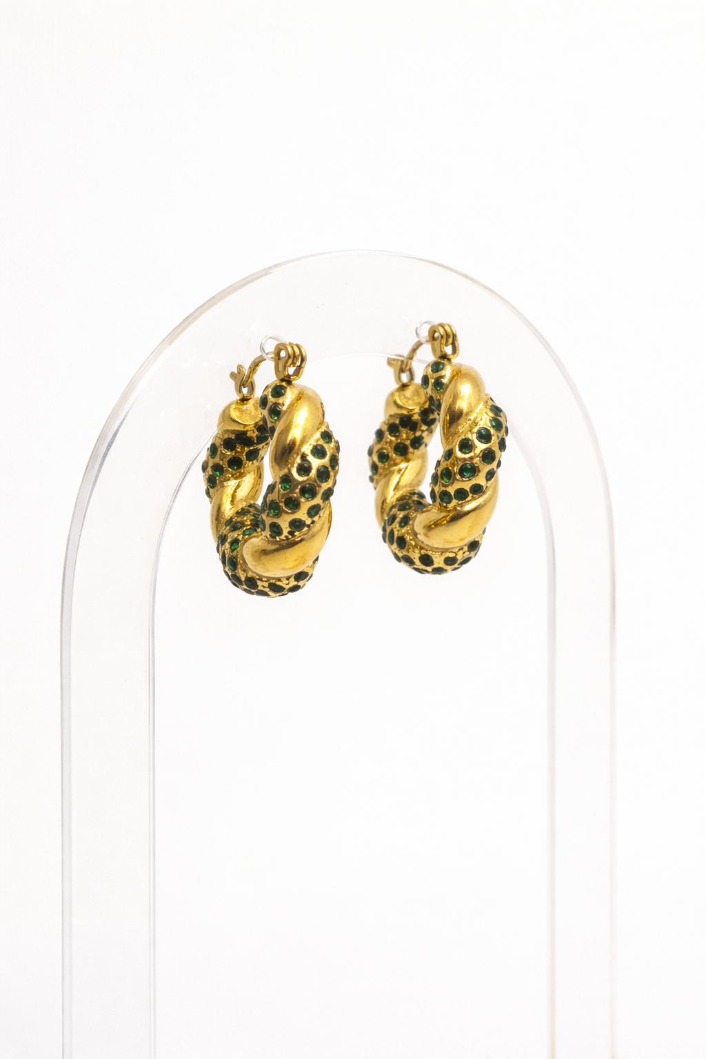 Gold twisted hoop earrings with green zirconia stones by Atelier Épure — bold, elegant, and refined.