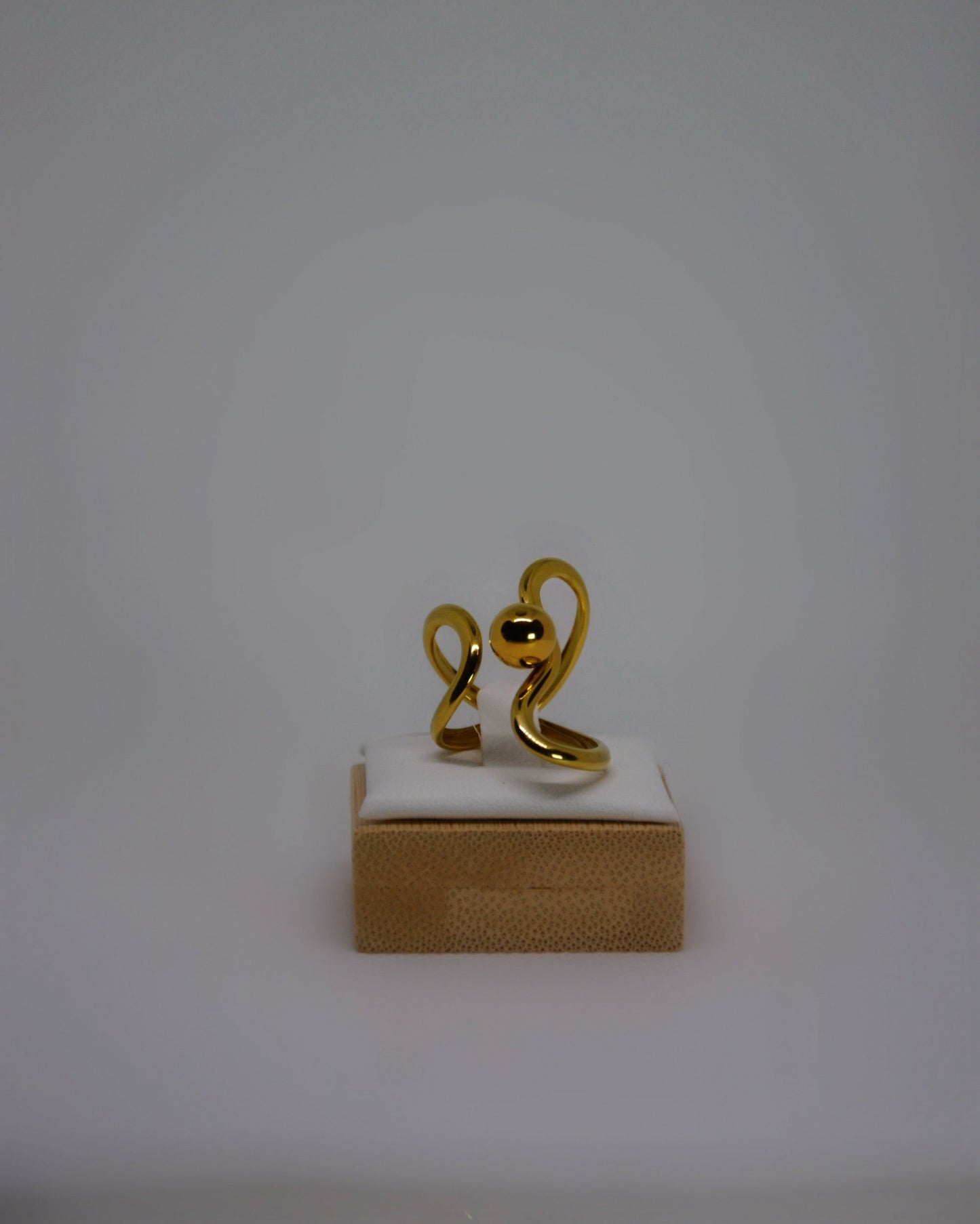 Lune Dorée Ring, gold-plated stainless steel ring by Atelier ÉPURE, featuring a sculptural curved design and polished golden shine.