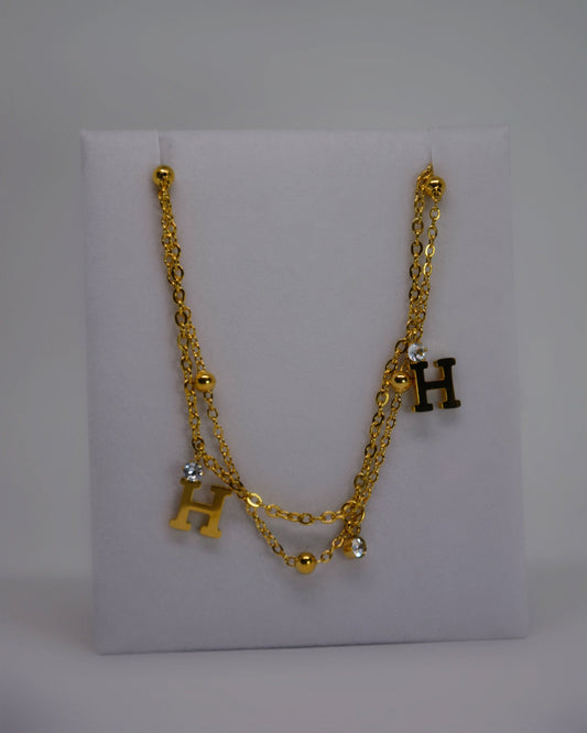 Honey Haze Bracelet gold-plated stainless steel double-wrap bracelet by Atelier ÉPURE, featuring crystal accents and delicate charm, water-resistant and hypoallergenic.