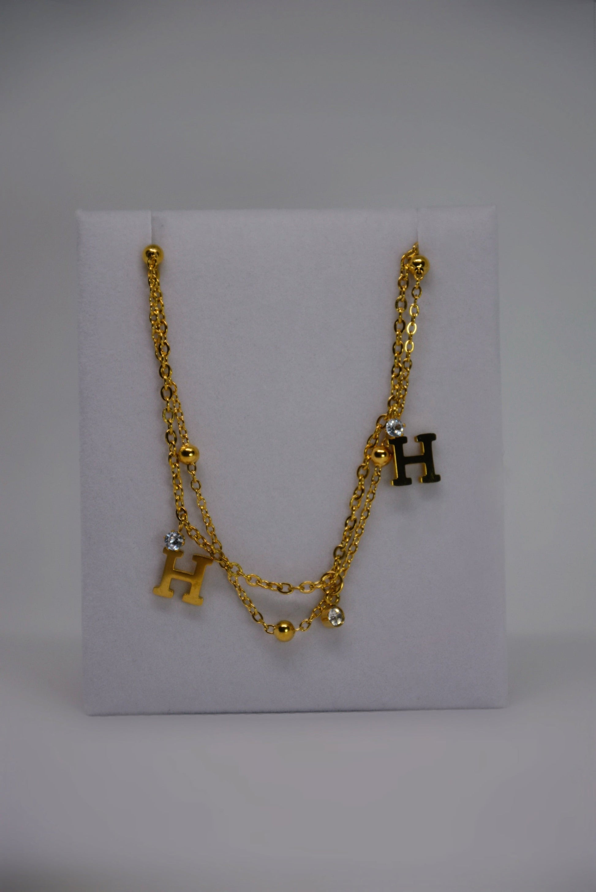 Honey Haze Bracelet gold-plated stainless steel double-wrap bracelet by Atelier ÉPURE, featuring crystal accents and delicate charm, water-resistant and hypoallergenic.