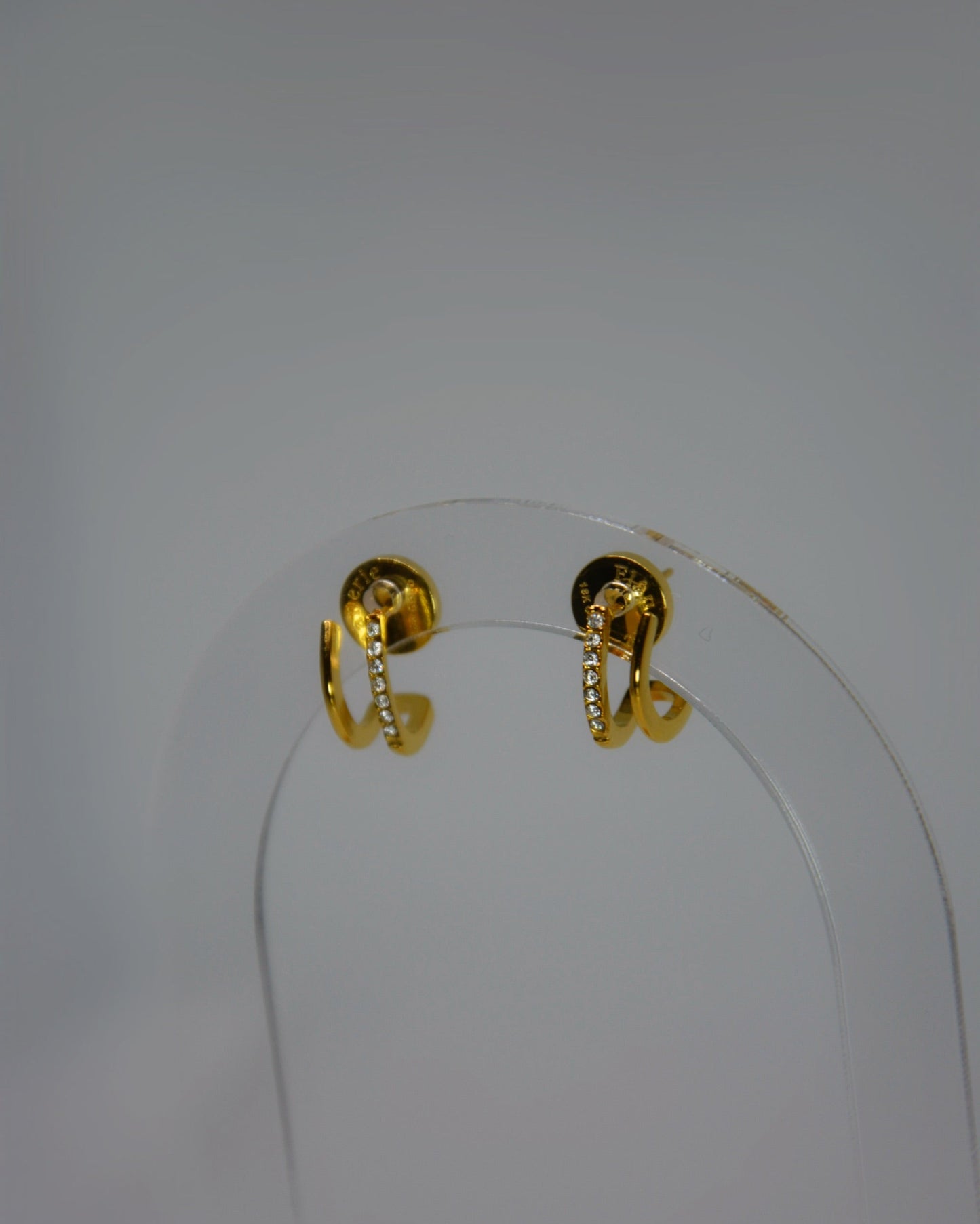 Rivea Earrings 18K gold-plated double hoop studs with sparkling cubic zirconia accents, designed for subtle, timeless elegance in the Atelier ÉPURE signature style.