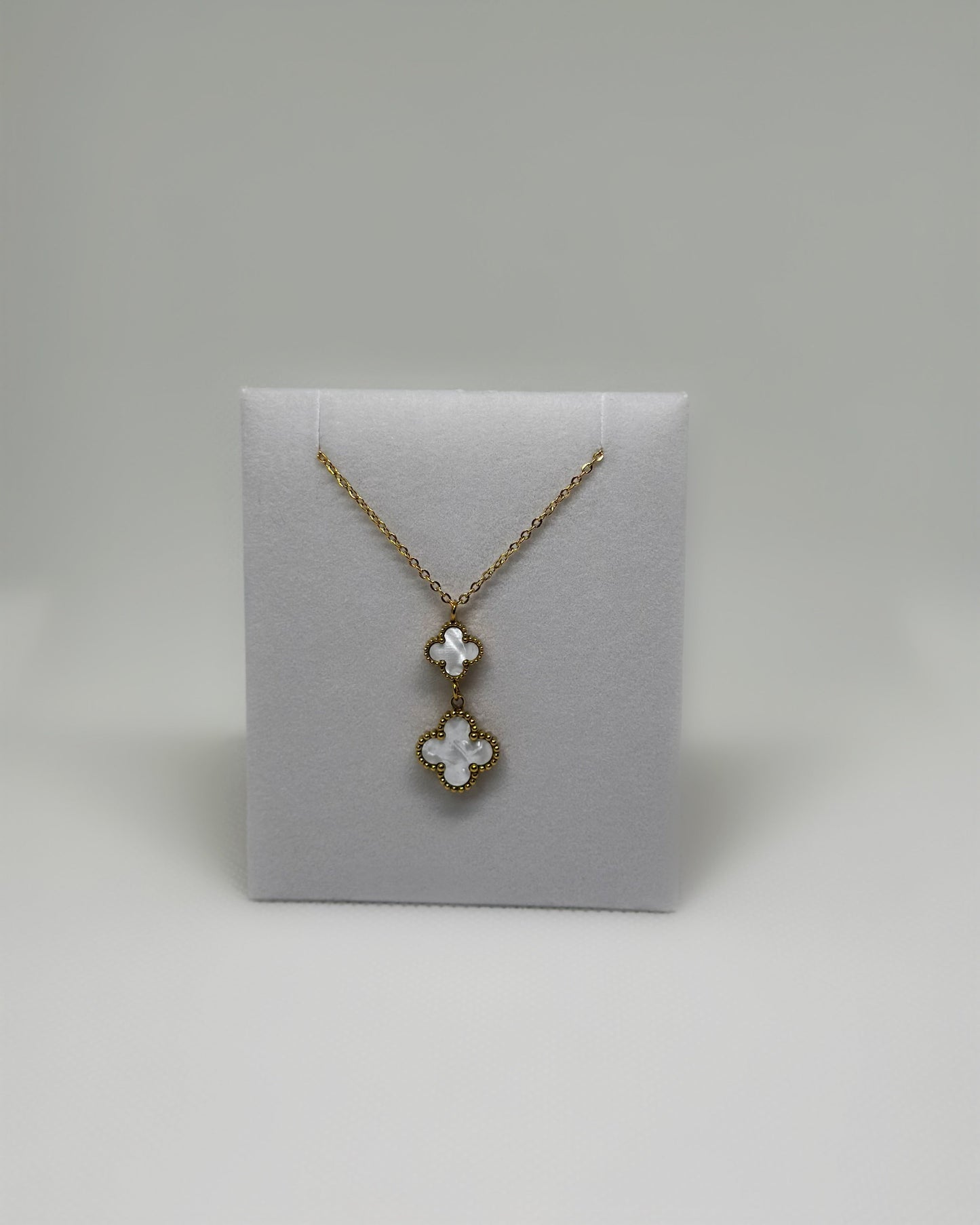 18K gold-plated double clover necklace with white enamel by Atelier Épure elegant, timeless, and effortlessly refined.
