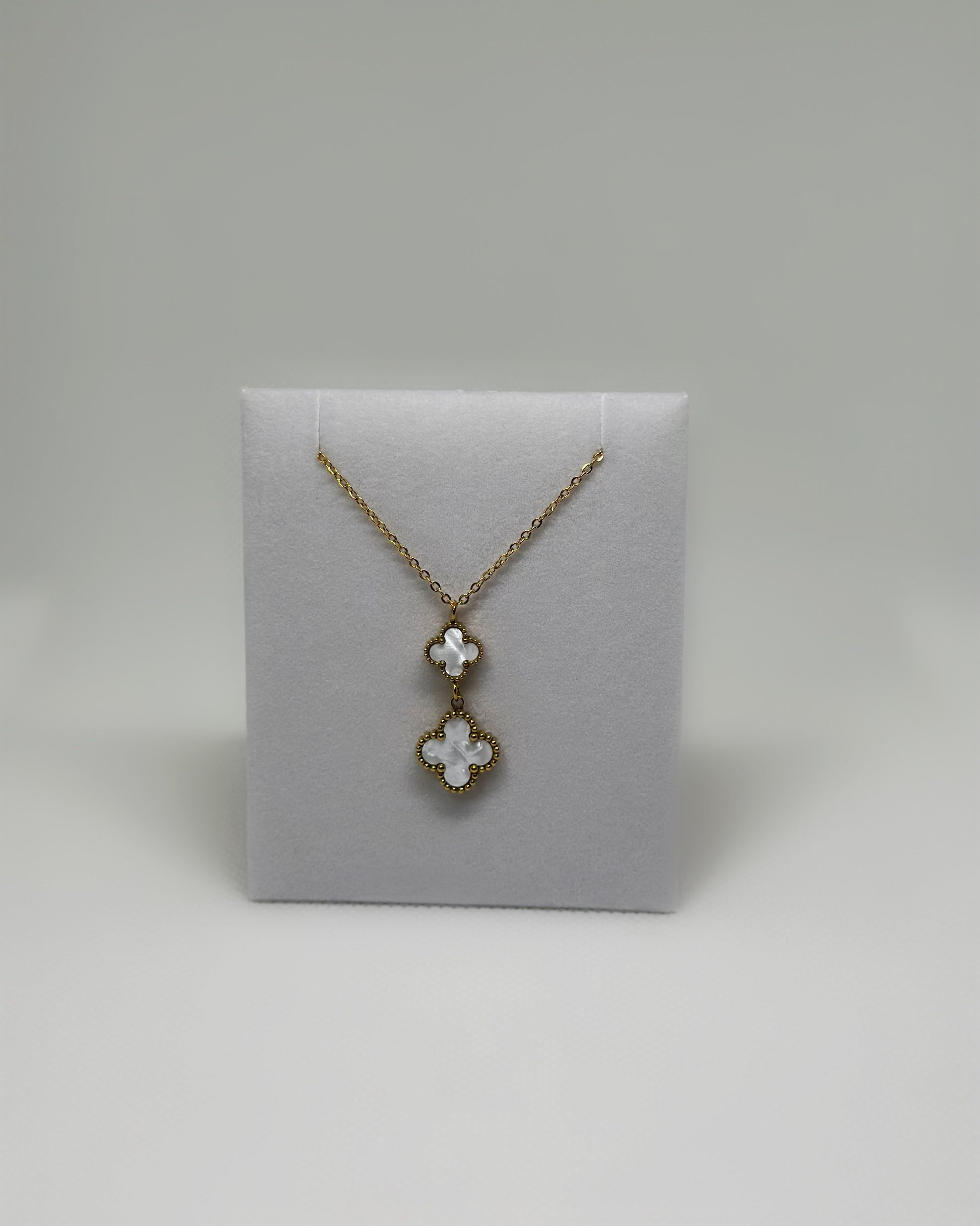 18K gold-plated double clover necklace with white enamel by Atelier Épure elegant, timeless, and effortlessly refined.