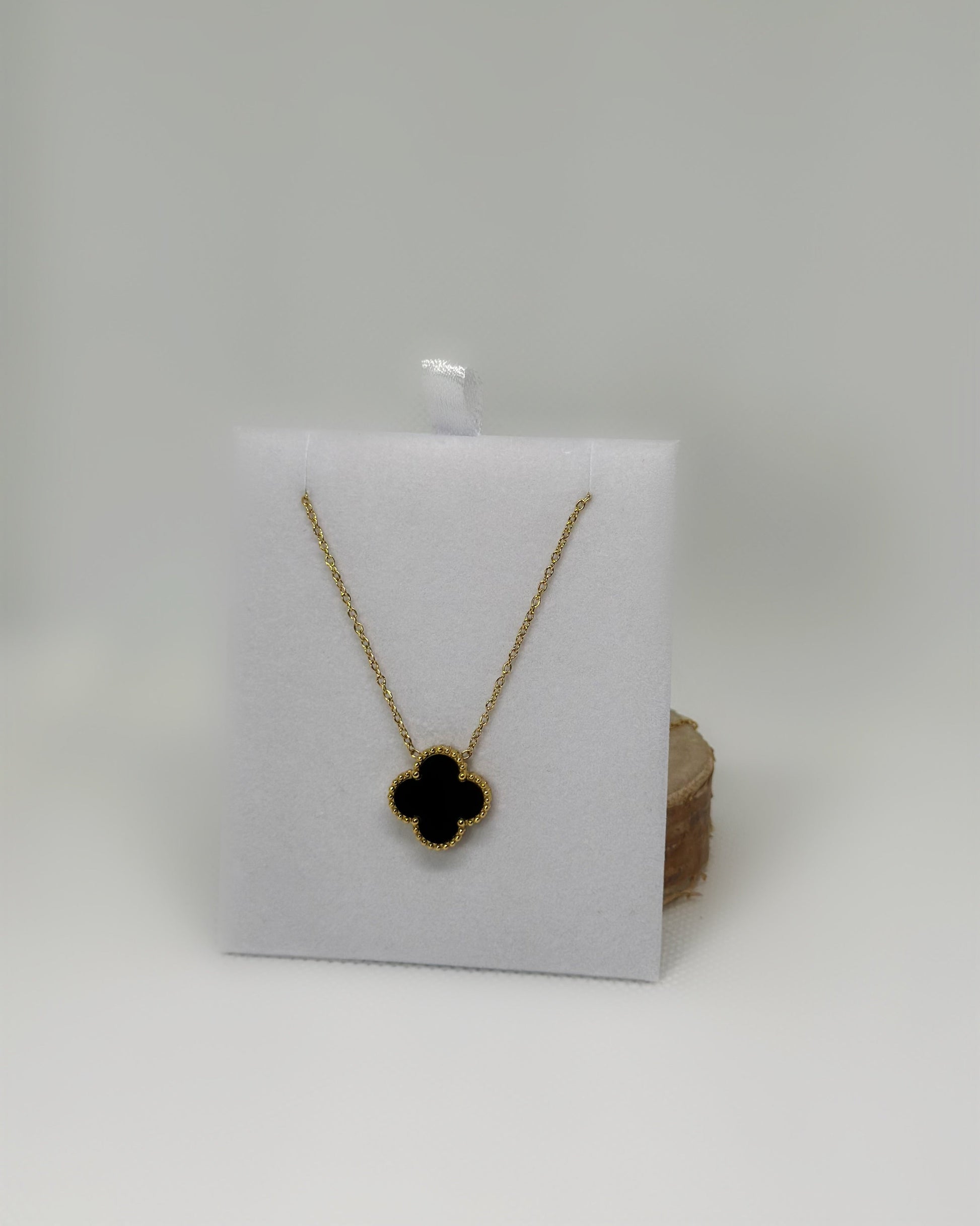 18K gold-plated clover necklace with black enamel by Atelier Épure, elegant, timeless, and effortlessly refined.