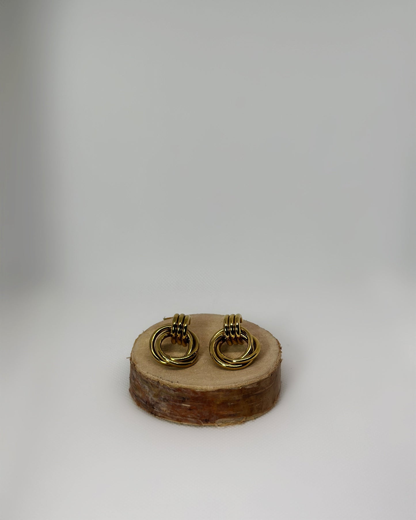 Lyra stainless-steel knot earrings by Atelier Épure. Elegant, timeless, and sculptural. Effortless sophistication designed to last.