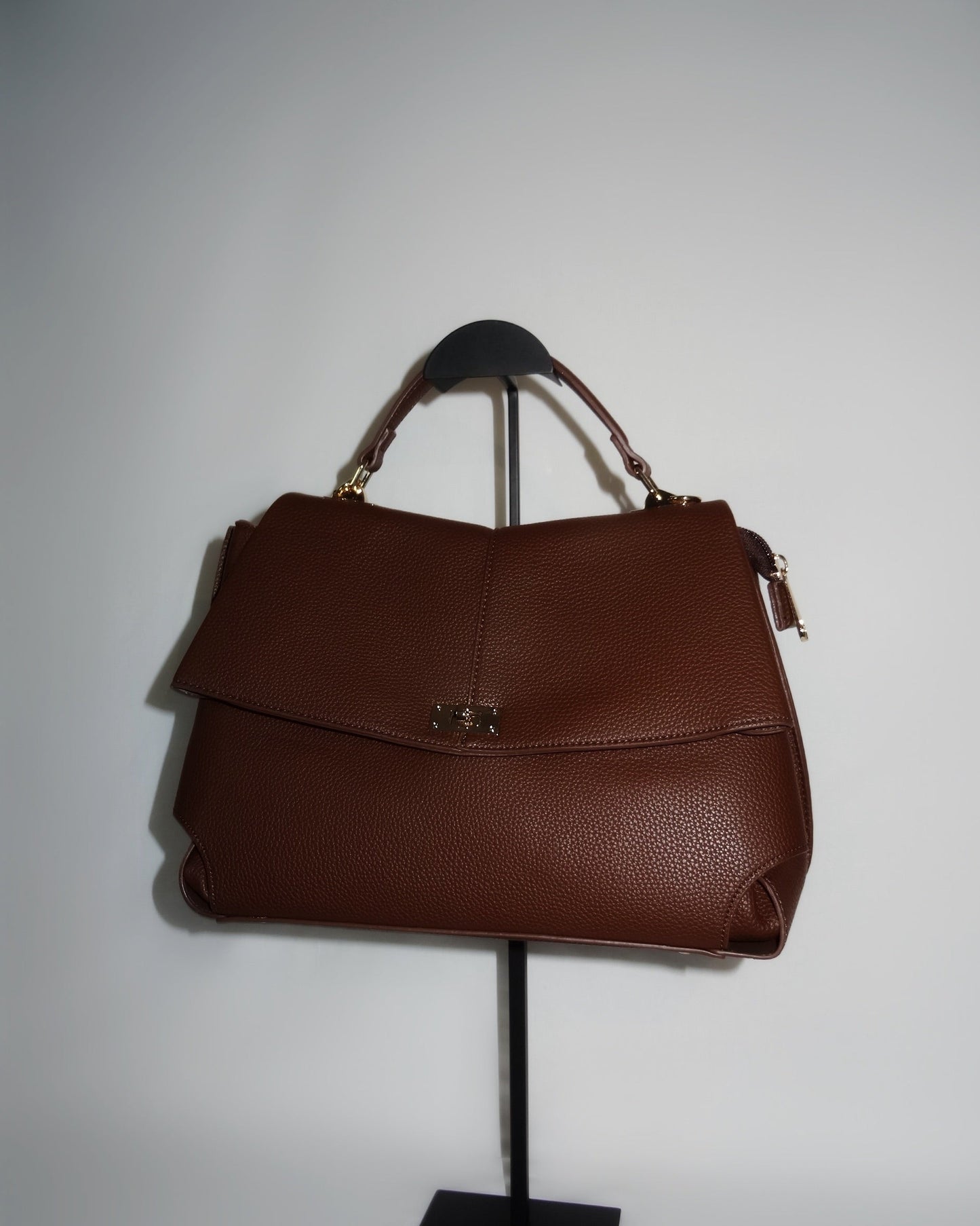 Brown structured handbag by Atelier Épure elegant, timeless, and effortlessly refined.