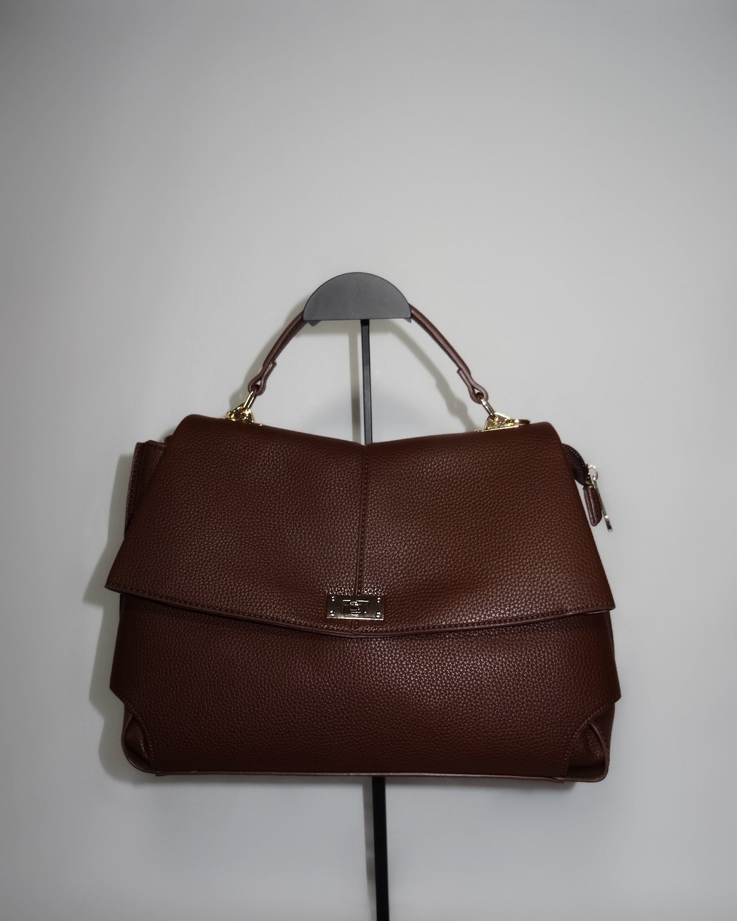 Brown structured handbag by Atelier Épure  elegant, timeless, and effortlessly refined.