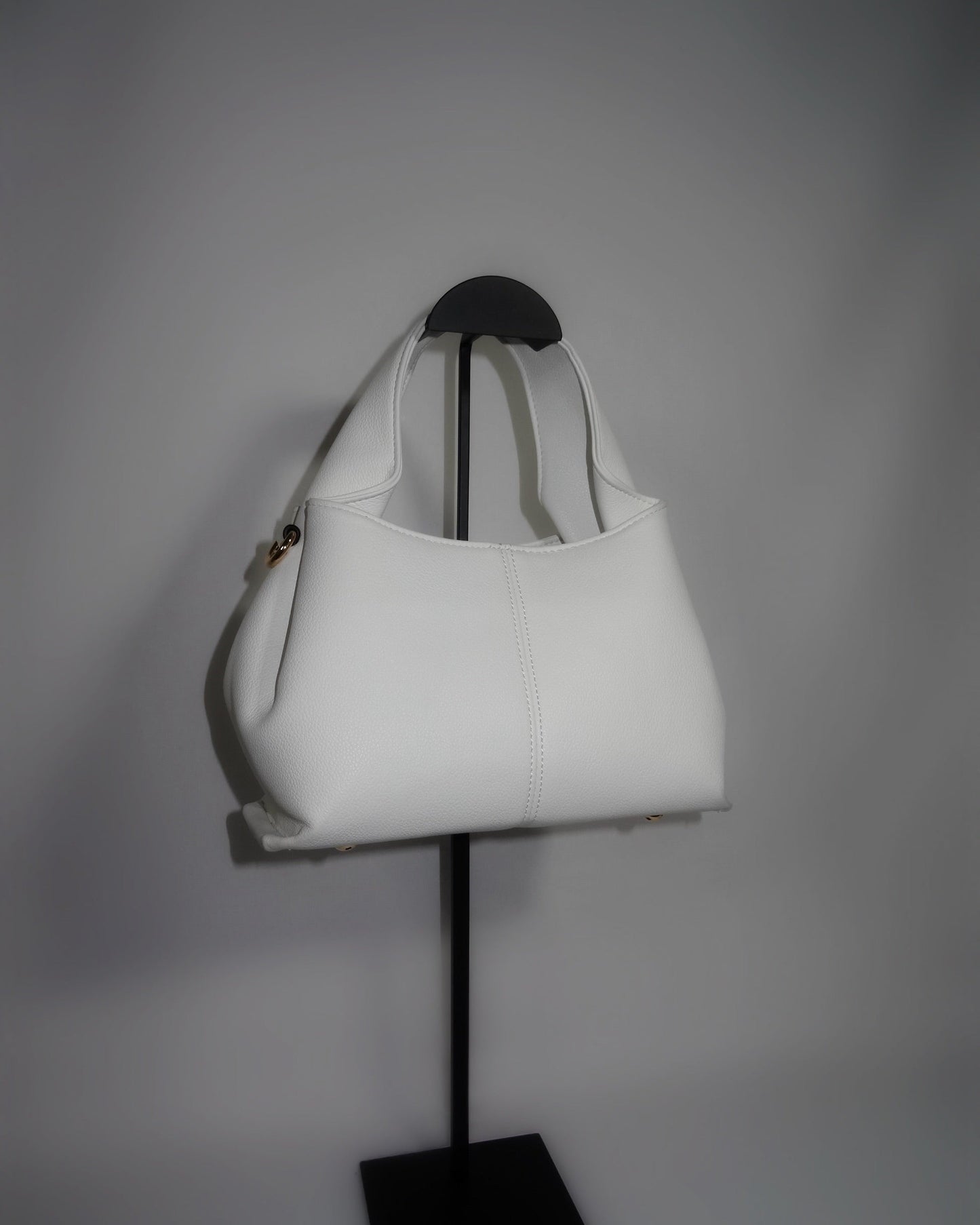 White sculptural handbag by Atelier Épure elegant, timeless, and effortlessly refined.