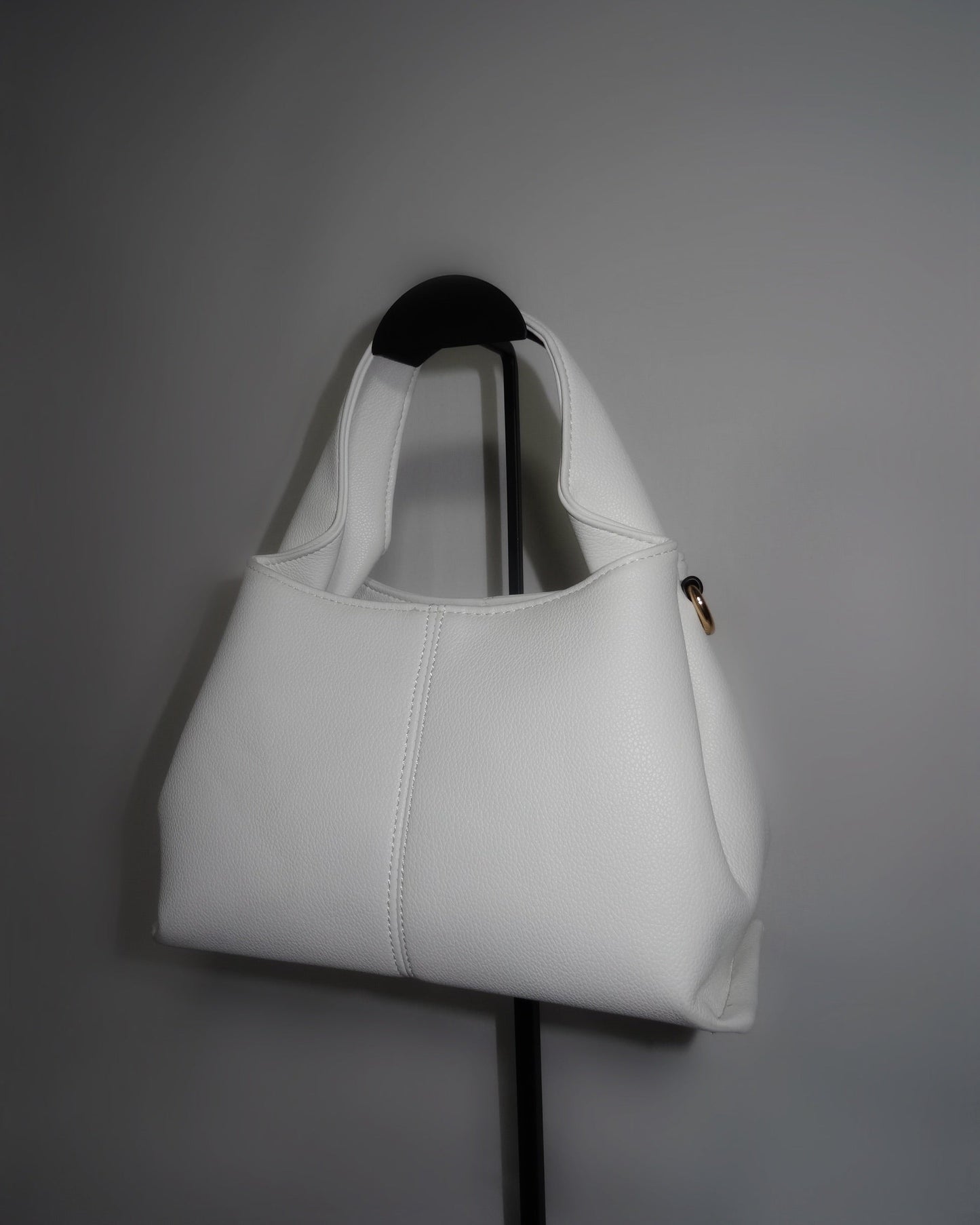 White sculptural handbag by Atelier Épure elegant, timeless, and effortlessly refined.