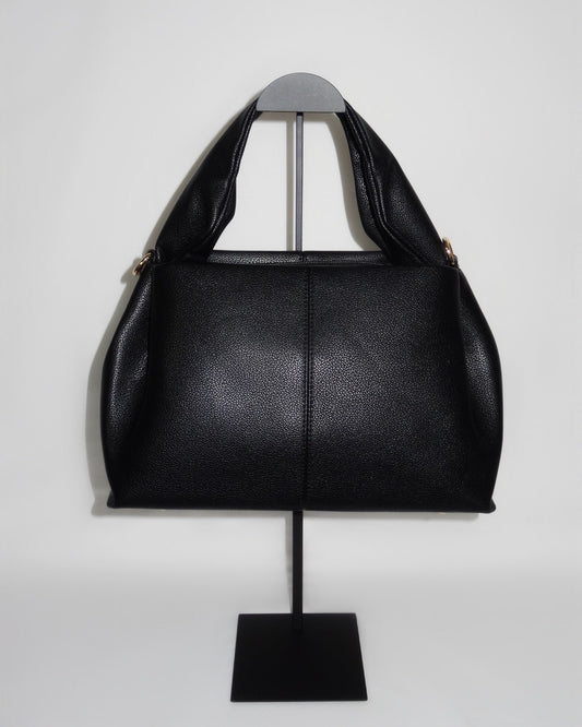 Black sculptural handbag by Atelier Épure elegant, timeless, and effortlessly refined.