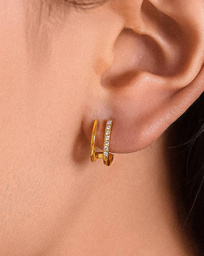 Rivea Earrings 18K gold-plated double hoop studs with sparkling cubic zirconia accents, designed for subtle, timeless elegance in the Atelier ÉPURE signature style.